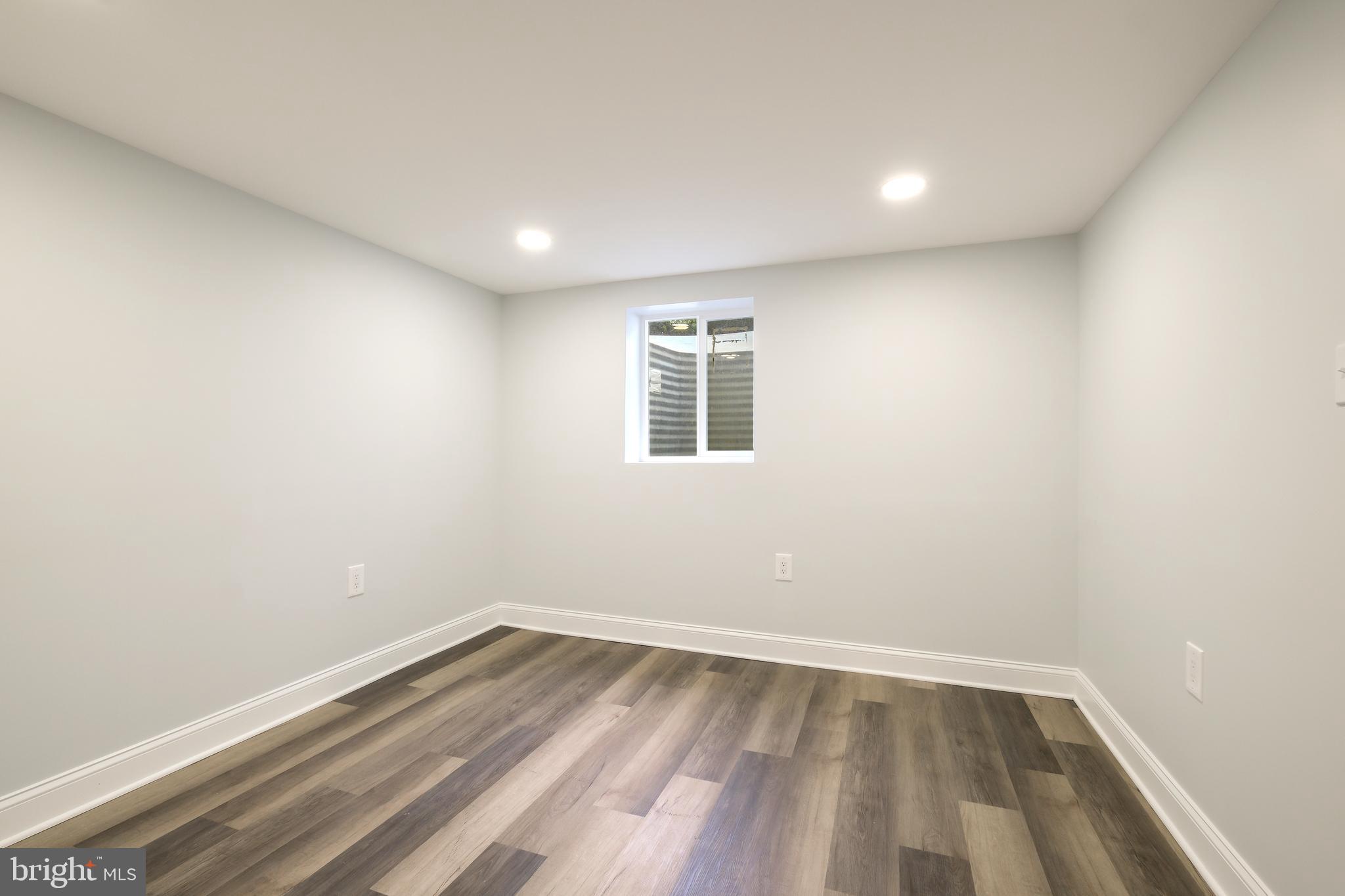 617 Greenbrier Drive Silver Spring, MD 20910 - Photo 28 of 60 a view of empty room with wooden floor and fan