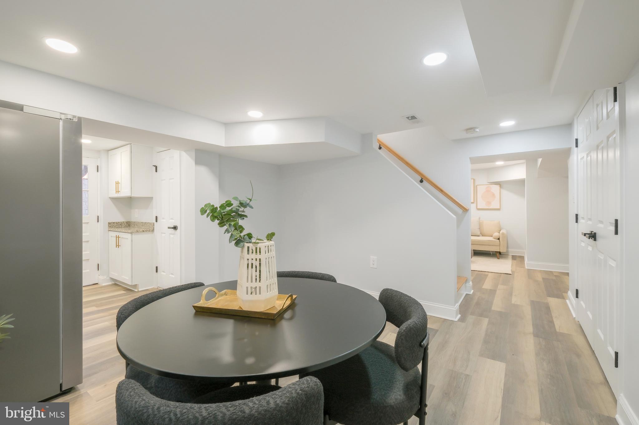 617 Greenbrier Drive Silver Spring, MD 20910 - Photo 32 of 60 a workspace with furniture and wooden floor