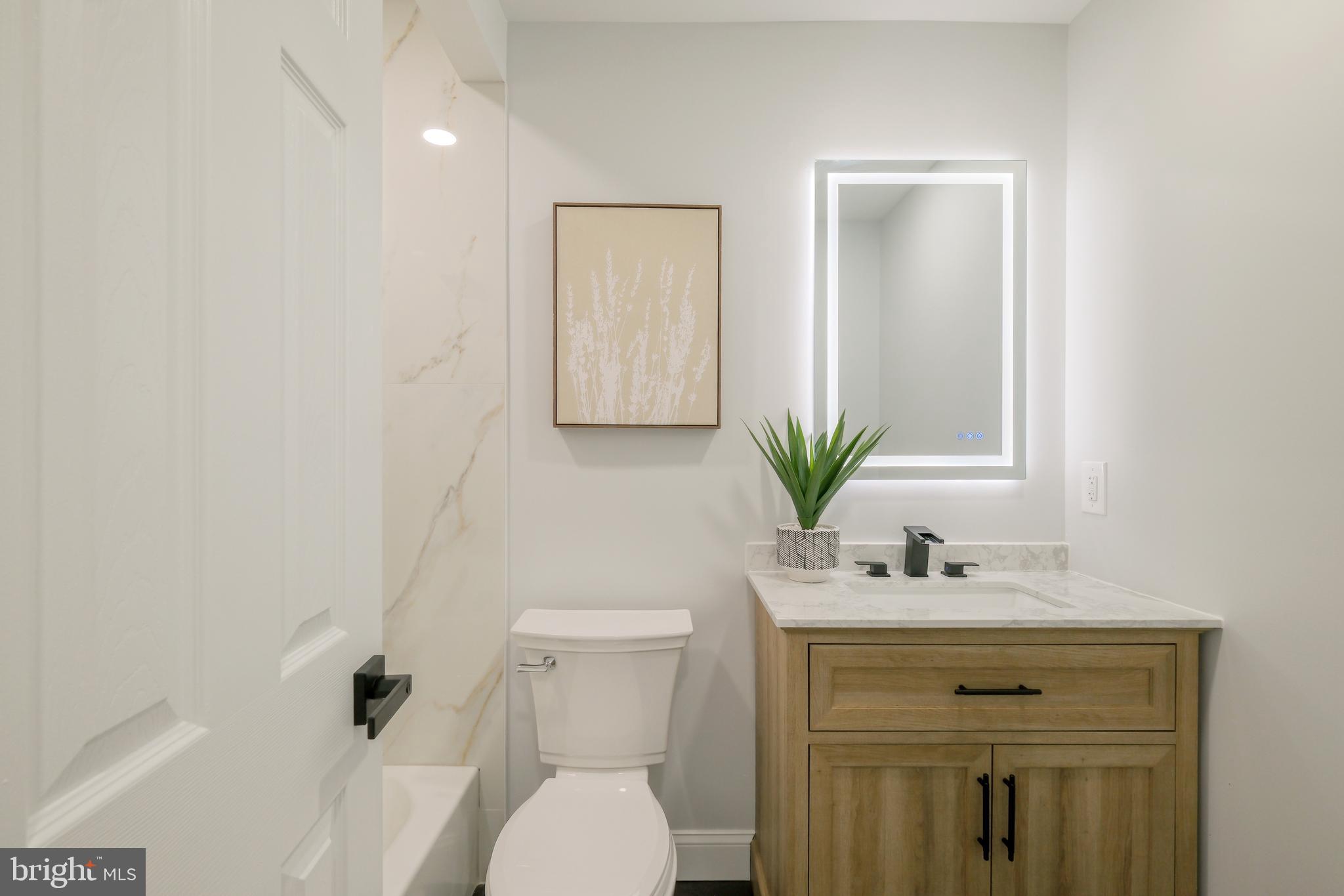 617 Greenbrier Drive Silver Spring, MD 20910 - Photo 34 of 60 a bathroom with a sink toilet and vanity