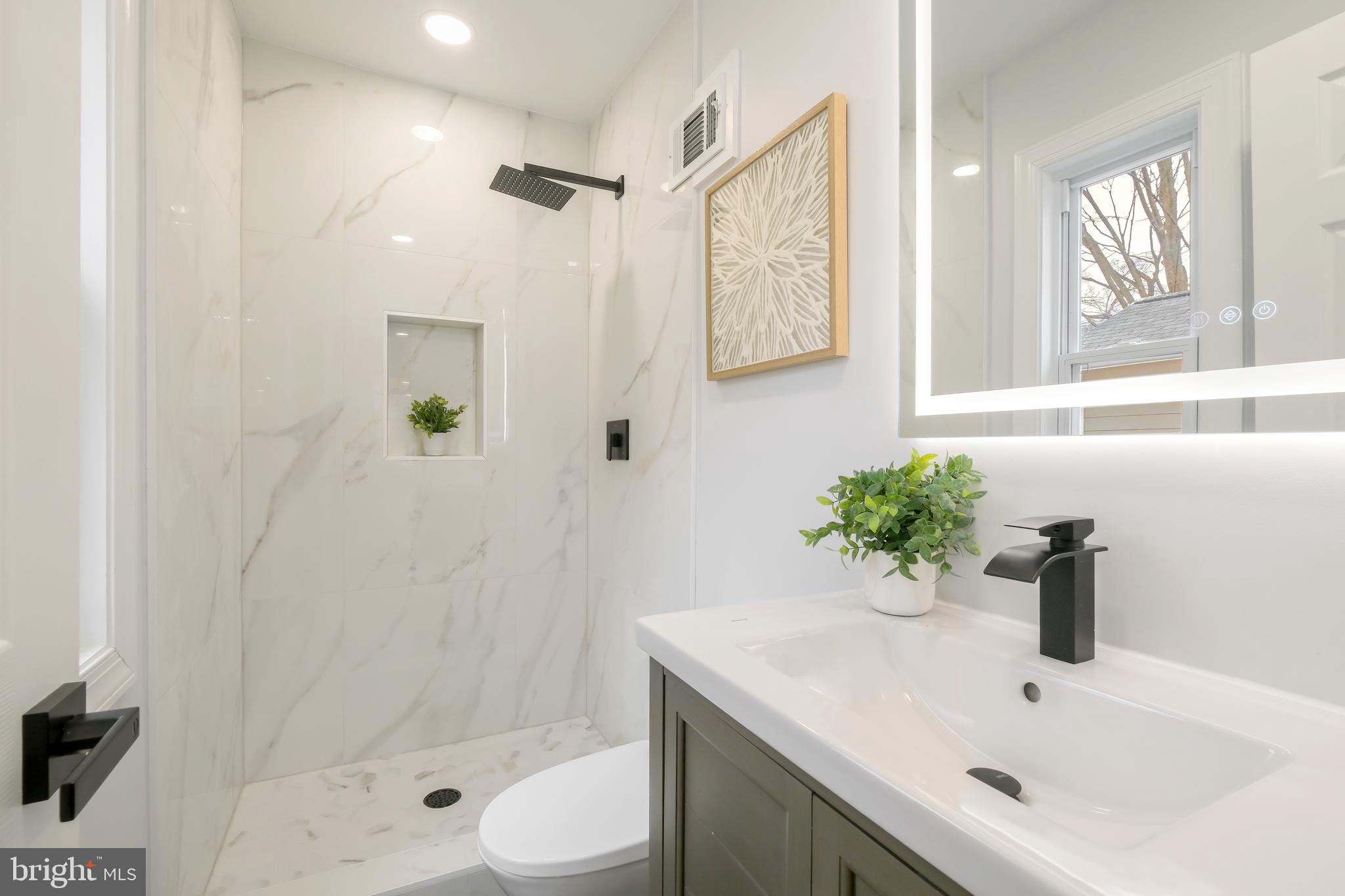 617 Greenbrier Drive Silver Spring, MD 20910 - Photo 35 of 60 a bathroom with a sink toilet and shower