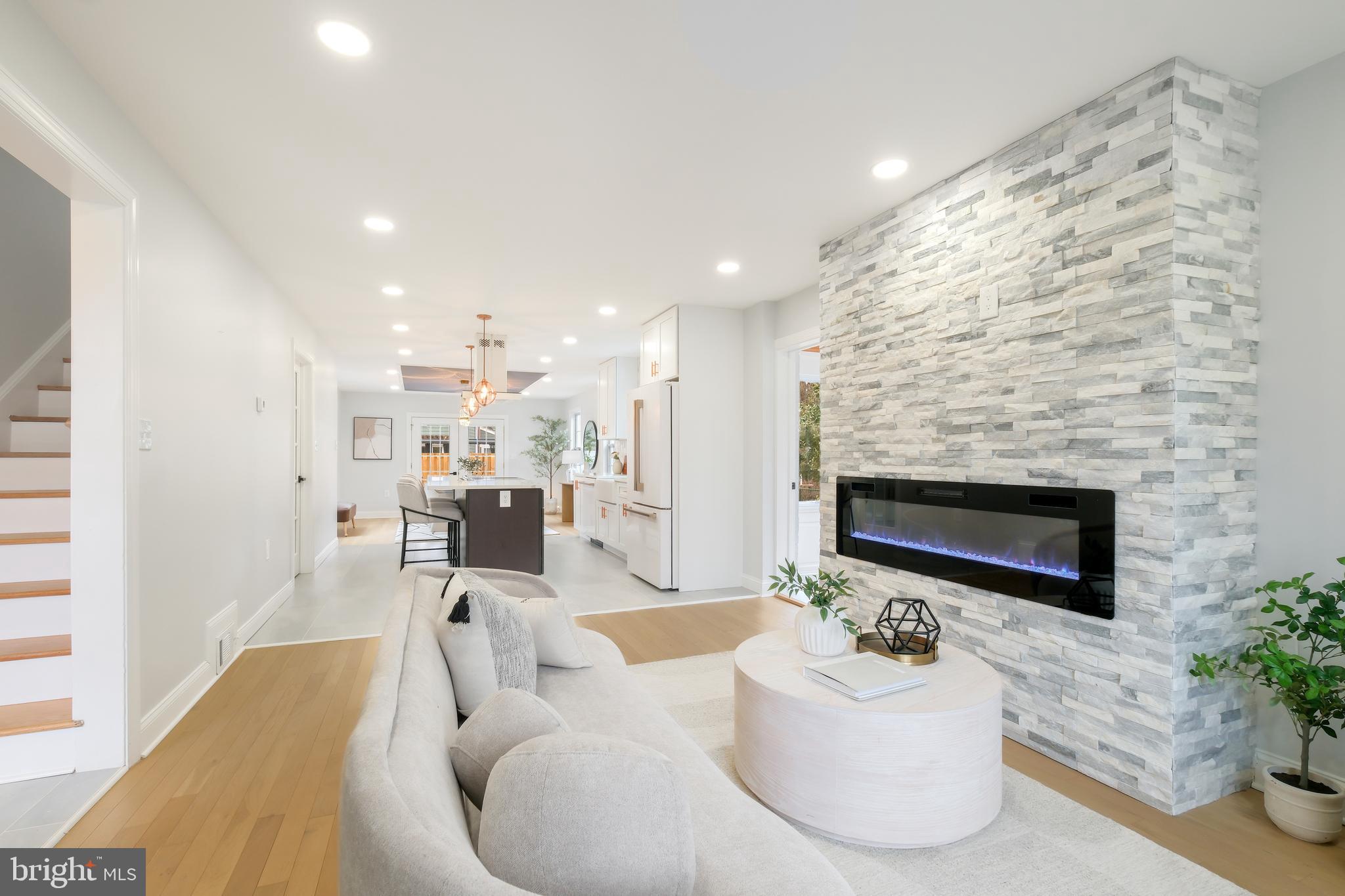617 Greenbrier Drive Silver Spring, MD 20910 - Photo 10 of 60 a living room with furniture and a fireplace