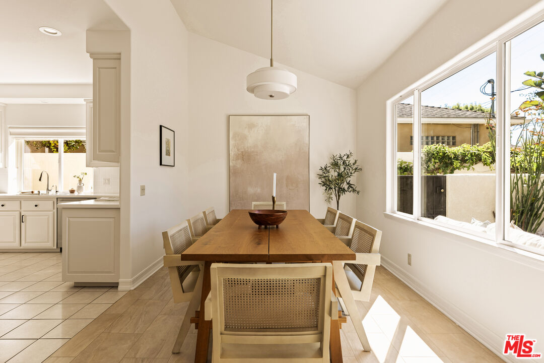 7825 Cowan Avenue Los Angeles, CA 90045 - Photo 12 of 33 a dining room with table and chairs