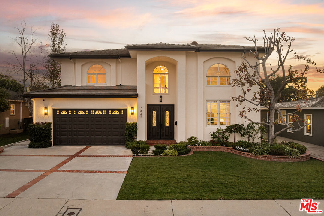 7825 Cowan Avenue Los Angeles, CA 90045 - Photo 2 of 33 a front view of a house with a yard