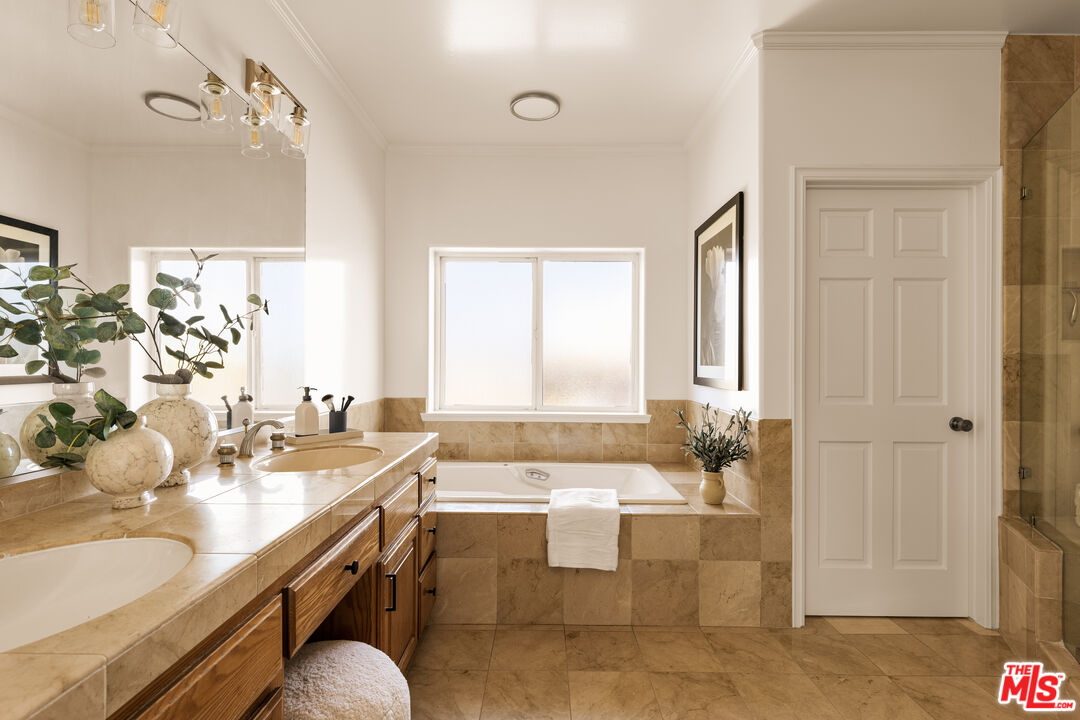 7825 Cowan Avenue Los Angeles, CA 90045 - Photo 21 of 33 a view of a bathroom with a tub sink and mirror