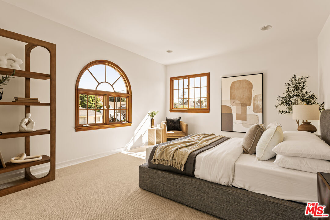 7825 Cowan Avenue Los Angeles, CA 90045 - Photo 22 of 33 a bedroom with a bed and a large window