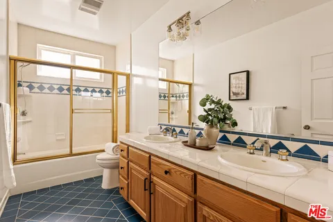 a bed room with a bed and a chair