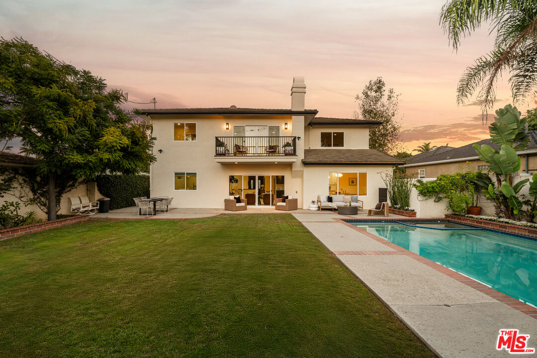 7825 Cowan Avenue Los Angeles, CA 90045 - Photo 30 of 33 a front view of a house with swimming pool having outdoor seating