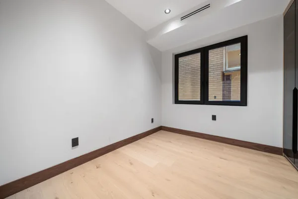 a bathroom with a sink and a potted plant