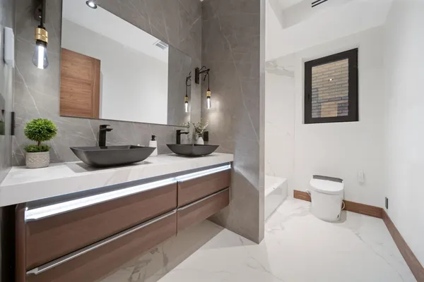 a bathroom with a toilet and a bathtub