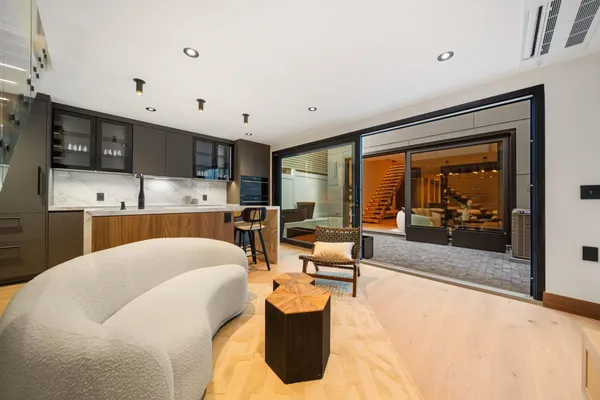 a view of a living room and entry way