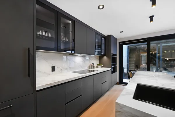 a bedroom with a bed and a potted plant