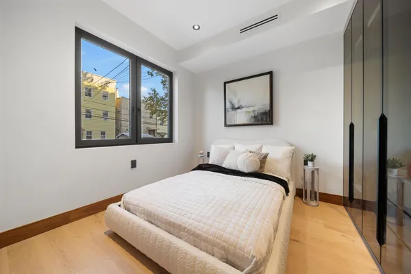 a bedroom with a bed and a cabinets