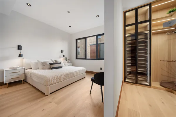 a bedroom with bed and a window