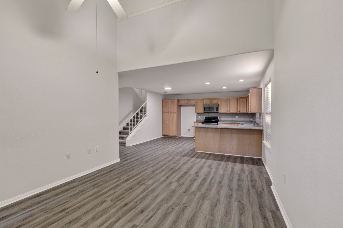 770 Hunt Road, Unit 212 Baytown, TX 77521 - Photo 11 of 40 a view of kitchen with closet and wooden floor