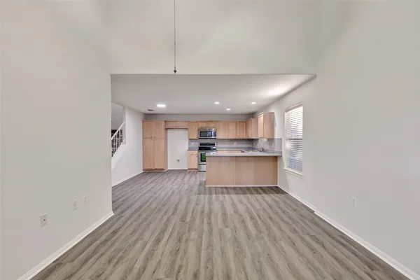 a view of kitchen with wooden floor
