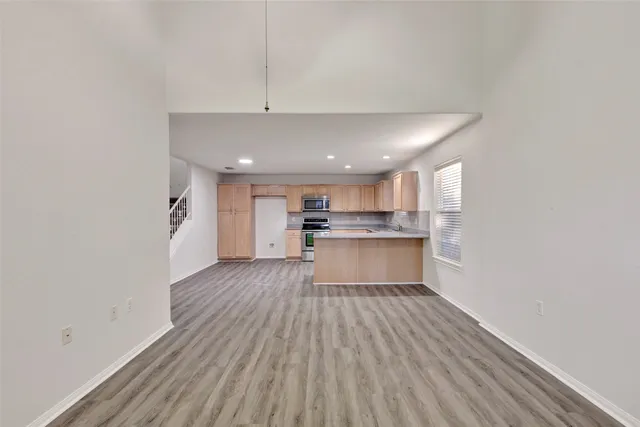 a view of kitchen with wooden floor