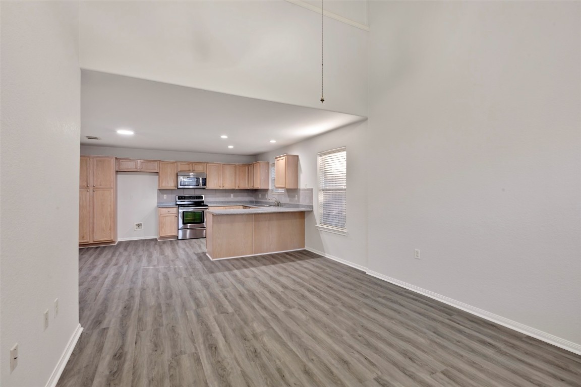 770 Hunt Road, Unit 212 Baytown, TX 77521 - Photo 13 of 40 a view of kitchen with wooden floor