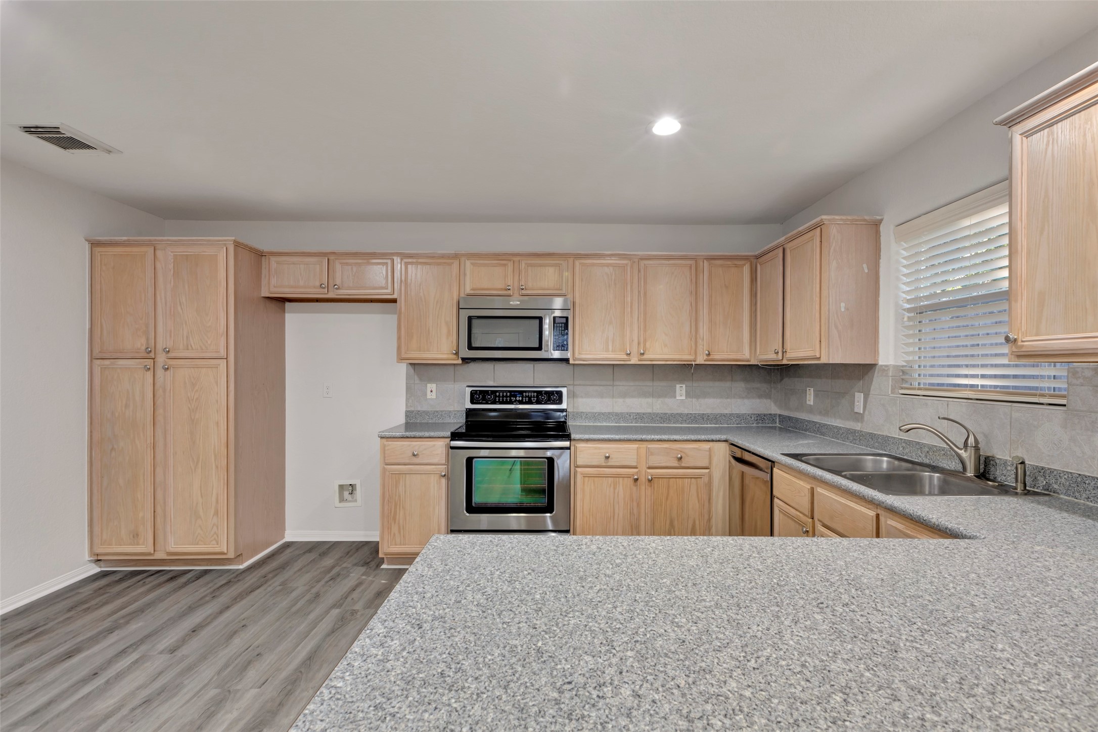 770 Hunt Road, Unit 212 Baytown, TX 77521 - Photo 18 of 40 a kitchen with stainless steel appliances granite countertop a refrigerator and a sink