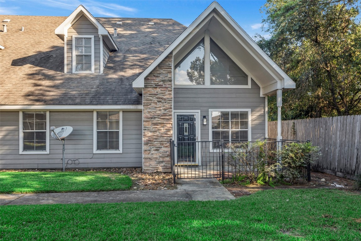 770 Hunt Road, Unit 212 Baytown, TX 77521 - Photo 2 of 40 a front view of a house with a yard and outdoor seating