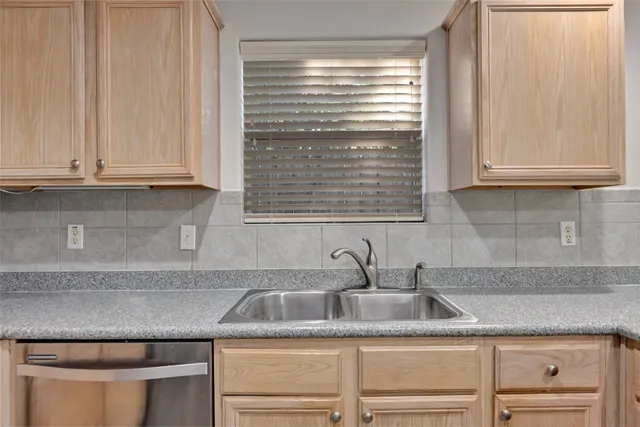 a stove top oven sitting inside of a kitchen