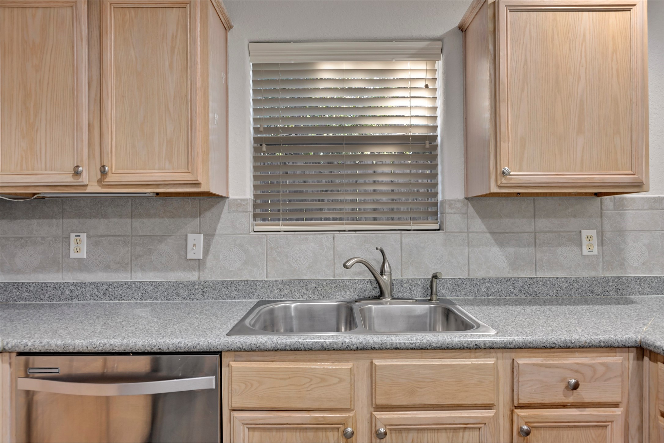 770 Hunt Road, Unit 212 Baytown, TX 77521 - Photo 22 of 40 a kitchen with granite countertop a sink and white cabinets