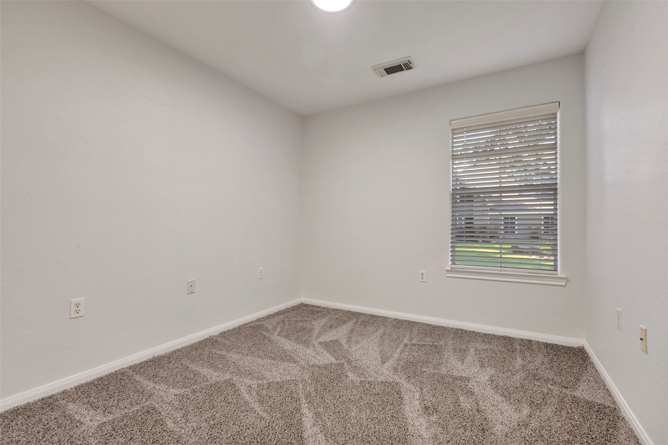 770 Hunt Road, Unit 212 Baytown, TX 77521 - Photo 26 of 40 a view of an empty room with a window