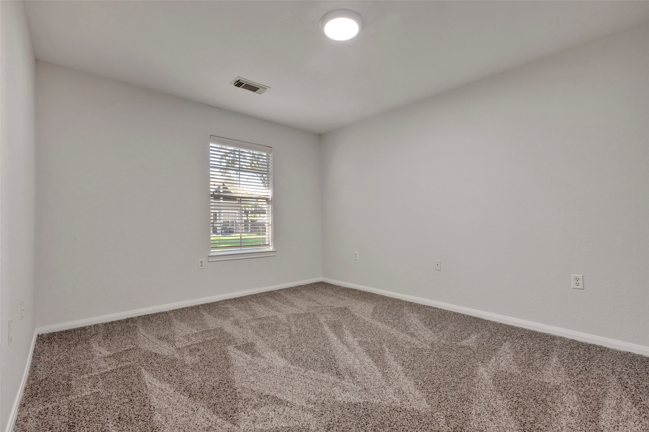 770 Hunt Road, Unit 212 Baytown, TX 77521 - Photo 27 of 40 a view of an empty room with a window