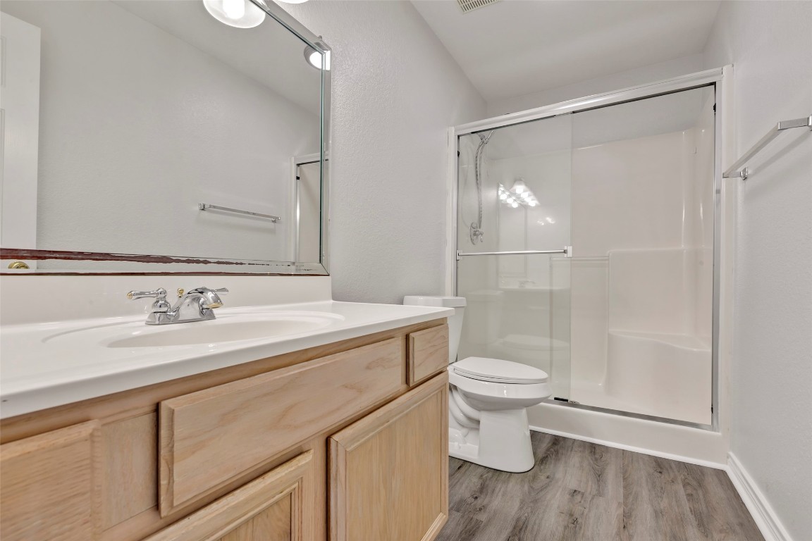 770 Hunt Road, Unit 212 Baytown, TX 77521 - Photo 35 of 40 a bathroom with a sink a toilet and shower