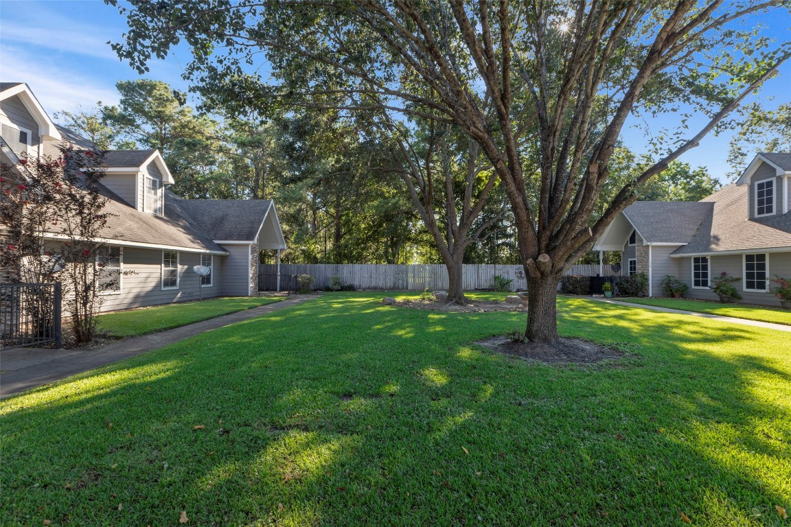 770 Hunt Road, Unit 212 Baytown, TX 77521 - Photo 39 of 40 a front view of a house with yard and green space