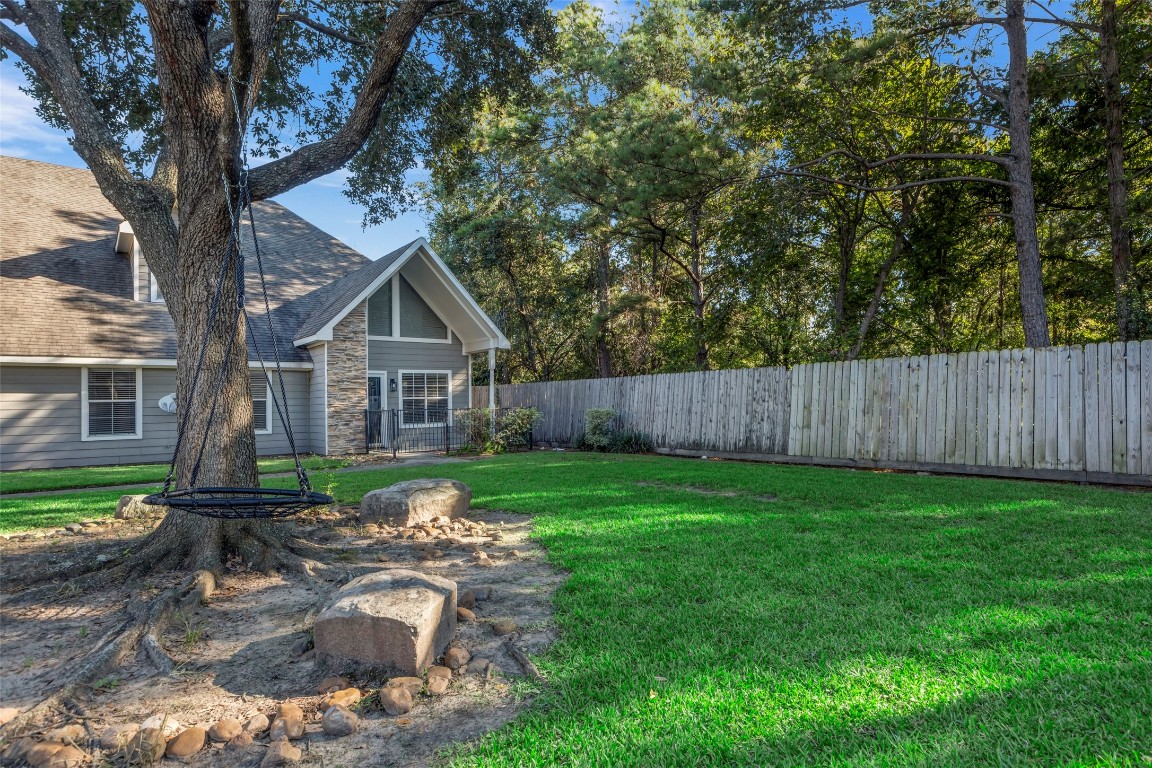 770 Hunt Road, Unit 212 Baytown, TX 77521 - Photo 4 of 40 a view of a house with backyard and a tree