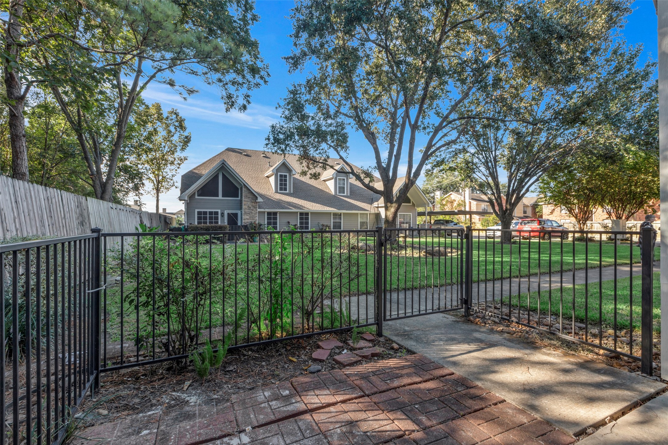770 Hunt Road, Unit 212 Baytown, TX 77521 - Photo 6 of 40 a view of a white house with a big yard and plants