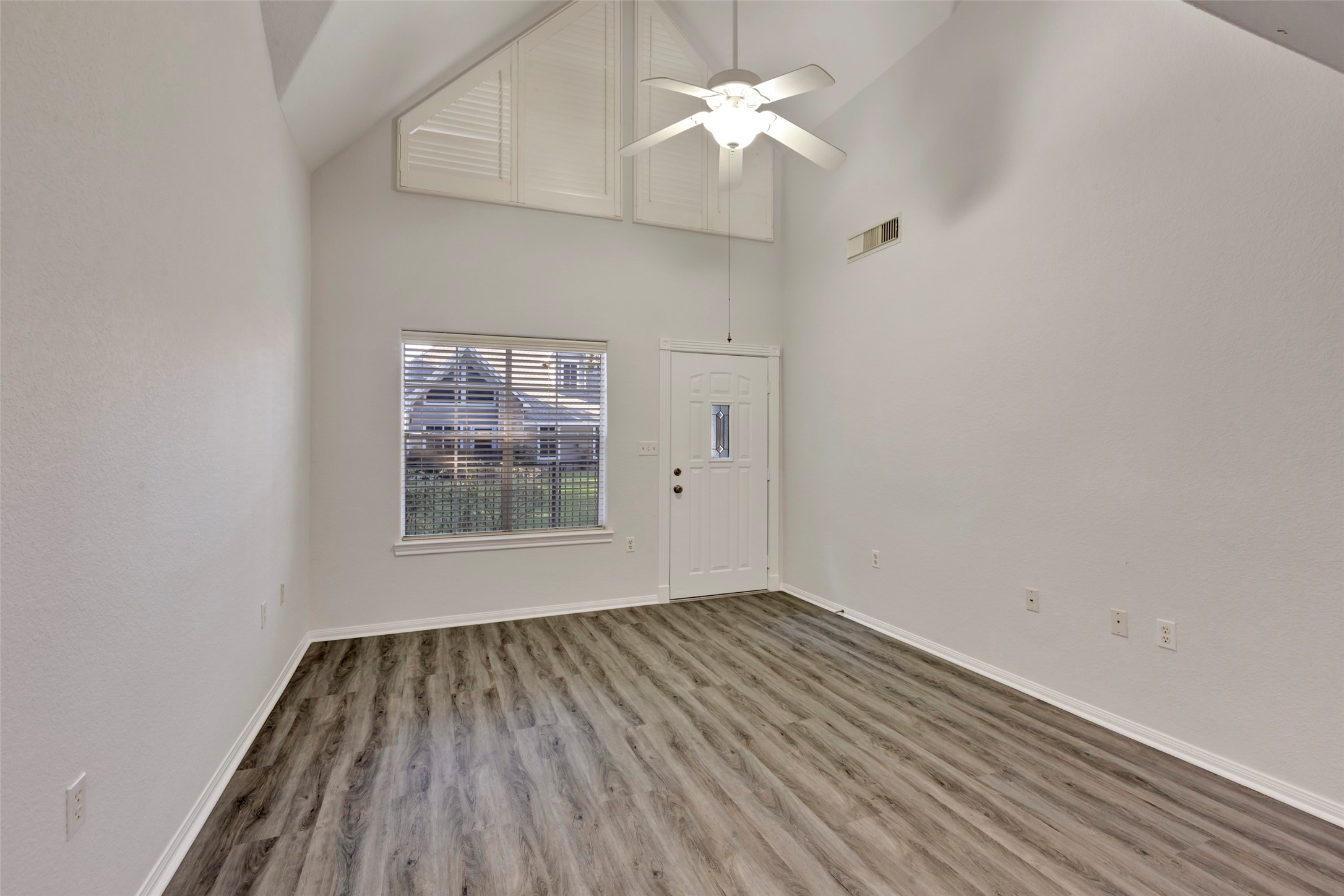 770 Hunt Road, Unit 212 Baytown, TX 77521 - Photo 10 of 40 wooden floor in an empty room with a window
