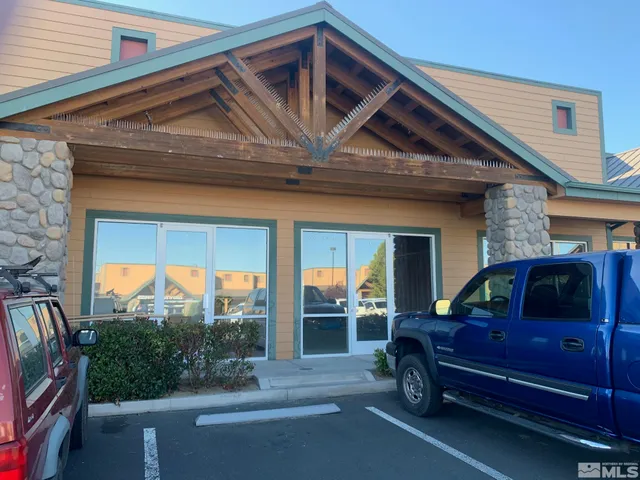 a view of a car park in front of house