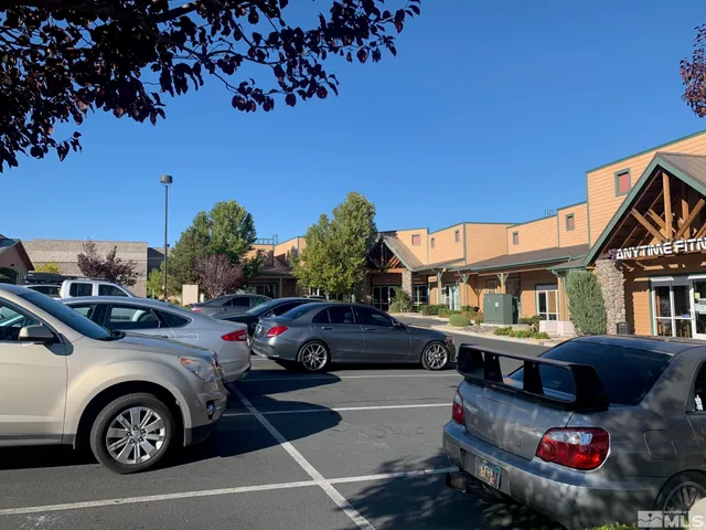 a view of a car parked in front of a house