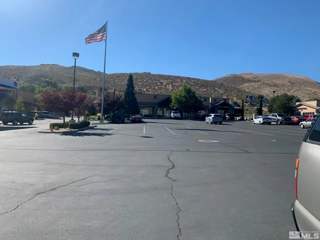 a view of a road with a building in the background