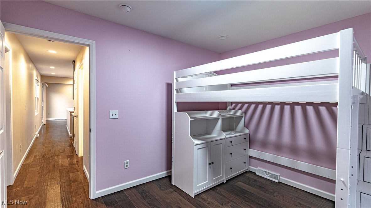 6264 Herbert Road Canfield, OH 44406 - Photo 24 of 47 Unfurnished bedroom featuring dark wood-style flooring and recessed lighting
