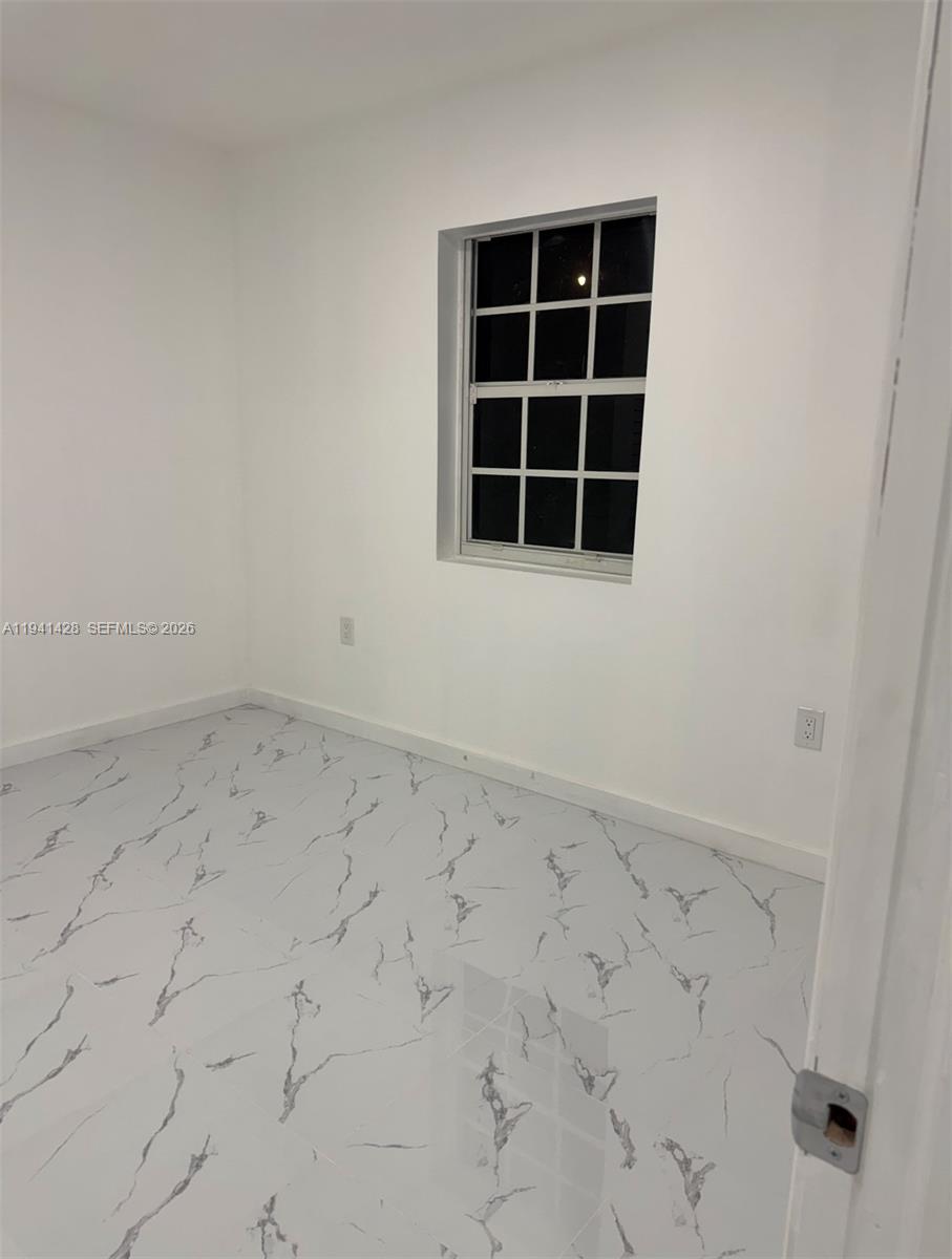 4200 Southwest 96th Avenue, Unit 2 Miami, FL 33165 - Photo 8 of 10 an empty room with windows