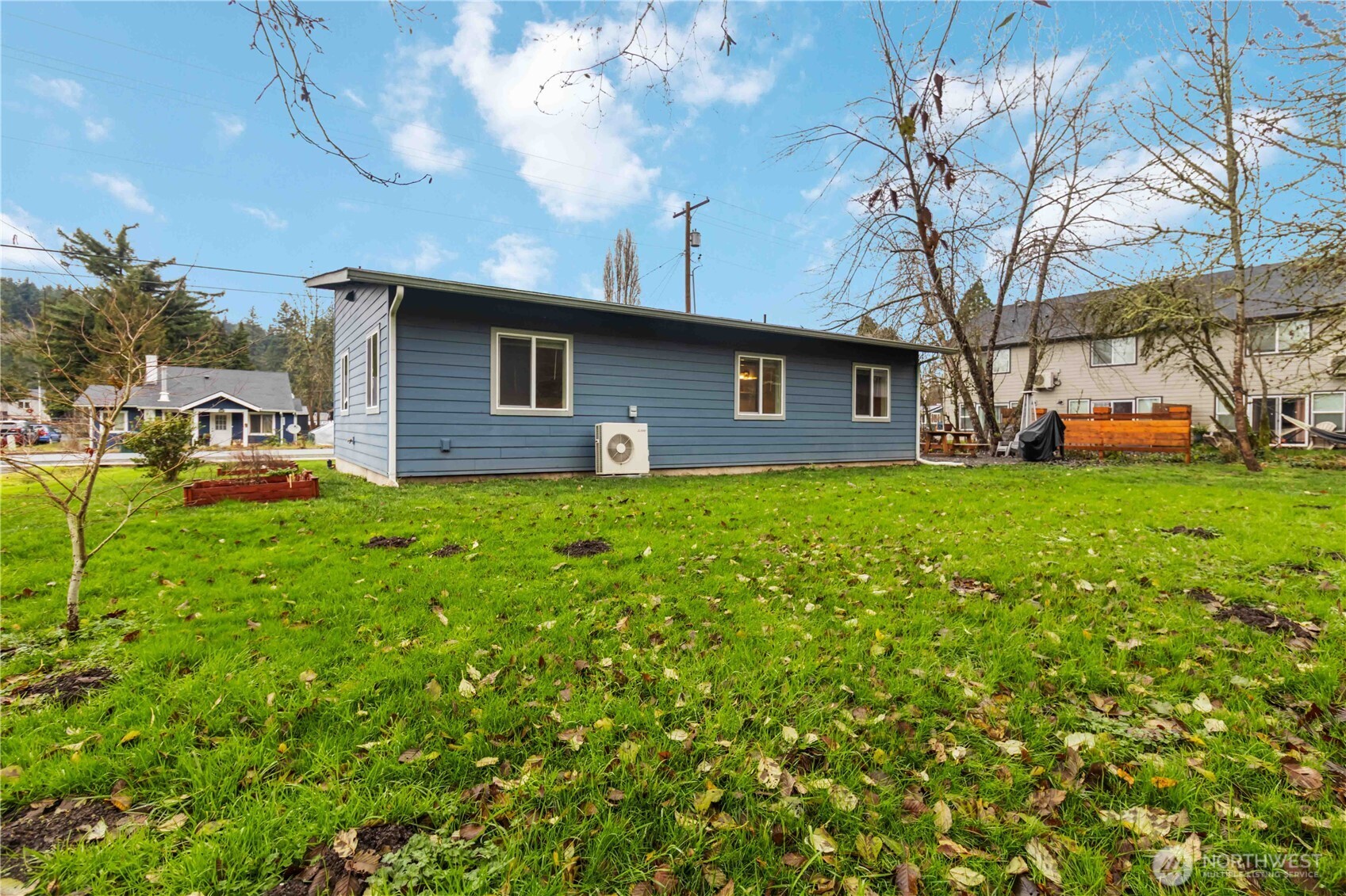 810 Southeast 1st Street Winlock, WA 98596 - Photo 13 of 35 a brick house with a big yard and large trees