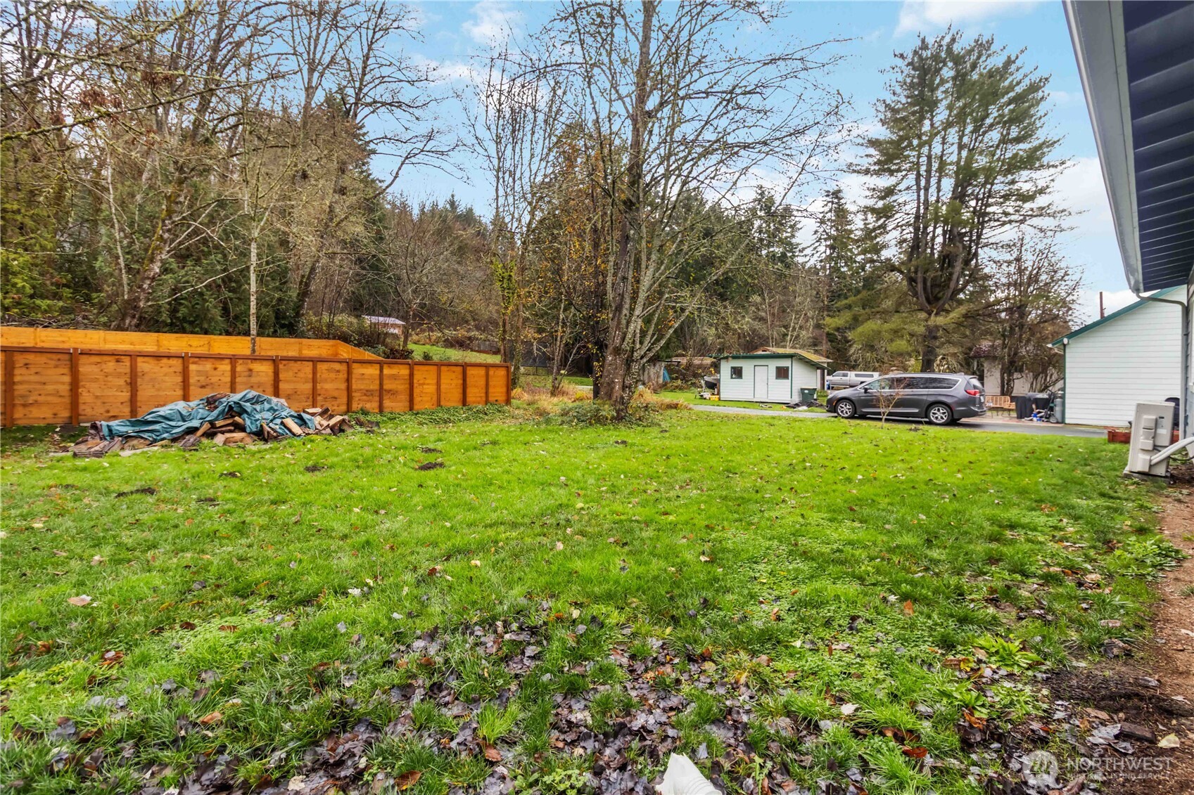 810 Southeast 1st Street Winlock, WA 98596 - Photo 16 of 35 a view of yard with swimming pool and trees