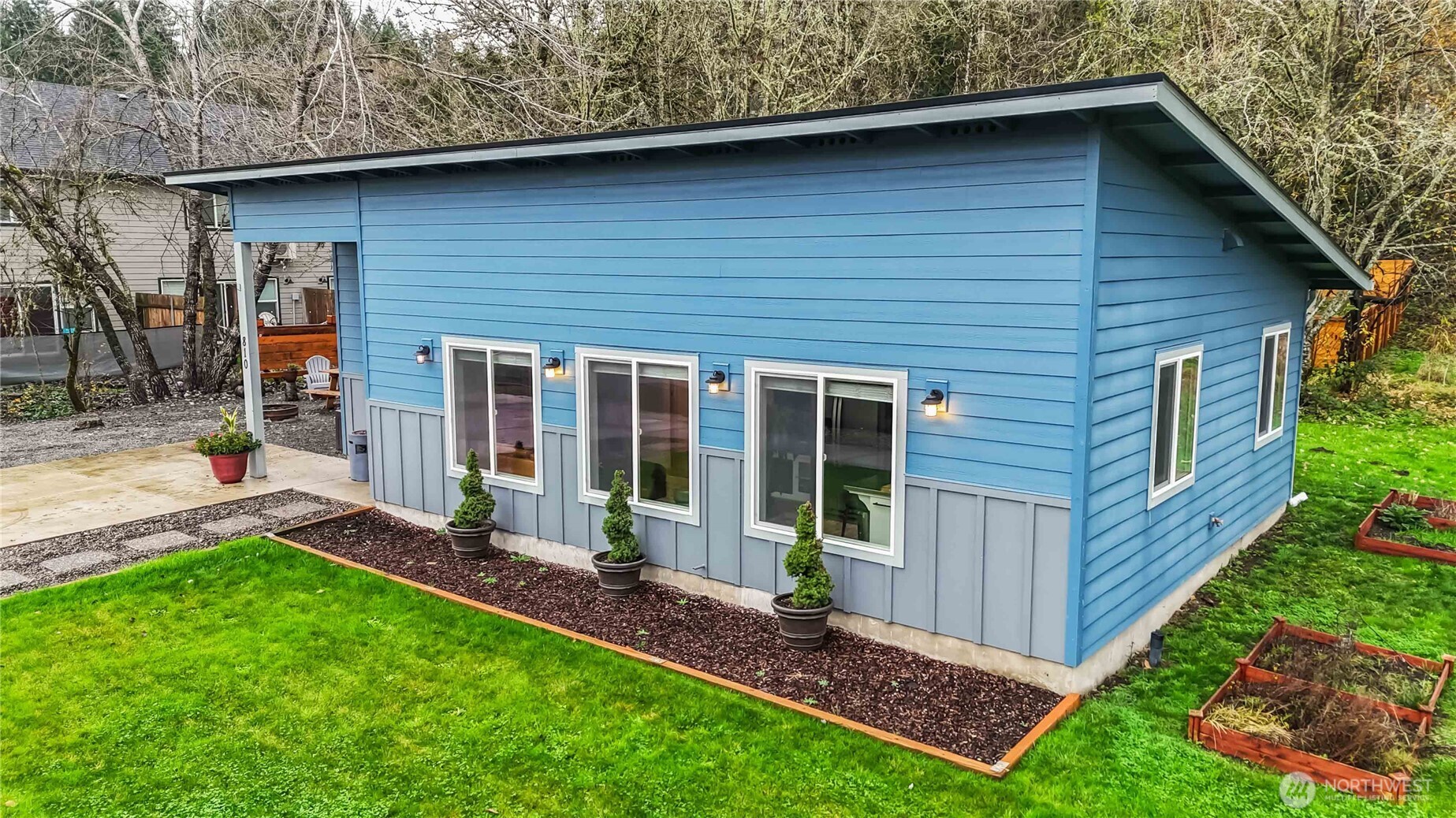 810 Southeast 1st Street Winlock, WA 98596 - Photo 2 of 35 a view of a house with a yard plants and large tree