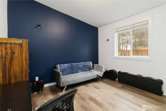 a bedroom with a bed and a desk