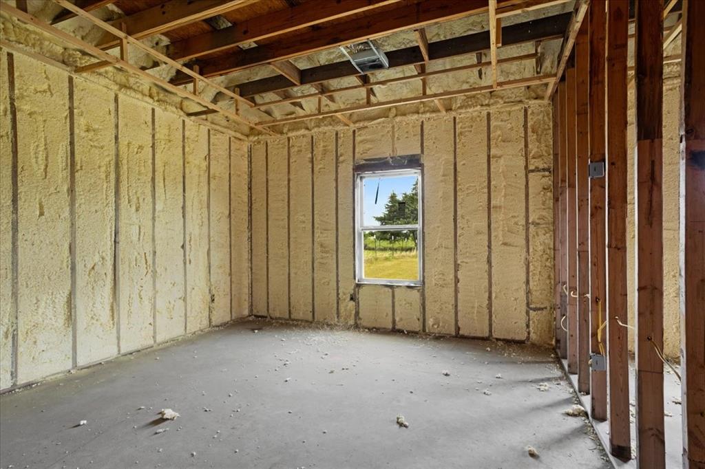 2463 County Road Bonham, TX 75418 - Photo 13 of 29 a view of a room with wooden walls
