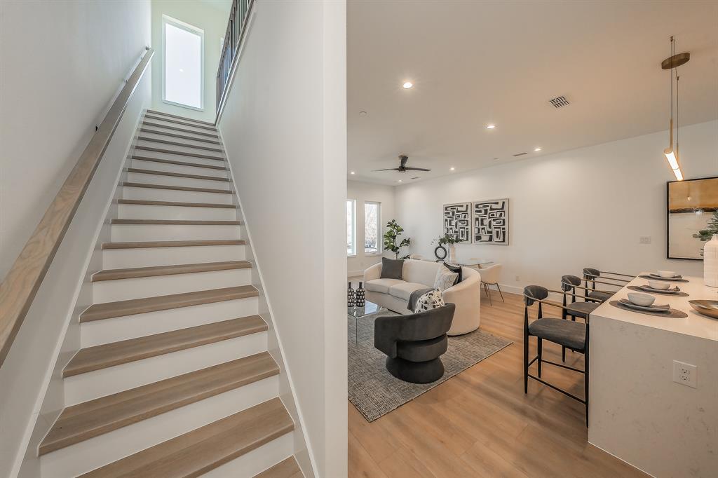 5320 Reiger Avenue, Unit 102 Dallas, TX 75214 - Photo 11 of 33 a view of entryway and hall with wooden floor