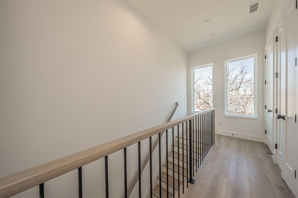 5320 Reiger Avenue, Unit 102 Dallas, TX 75214 - Photo 14 of 33 a view of a hallway with windows