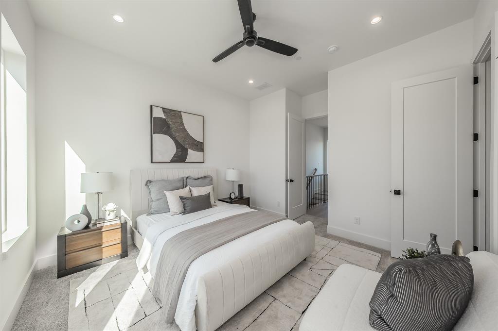 5320 Reiger Avenue, Unit 102 Dallas, TX 75214 - Photo 17 of 33 a bedroom with bed and a chandelier