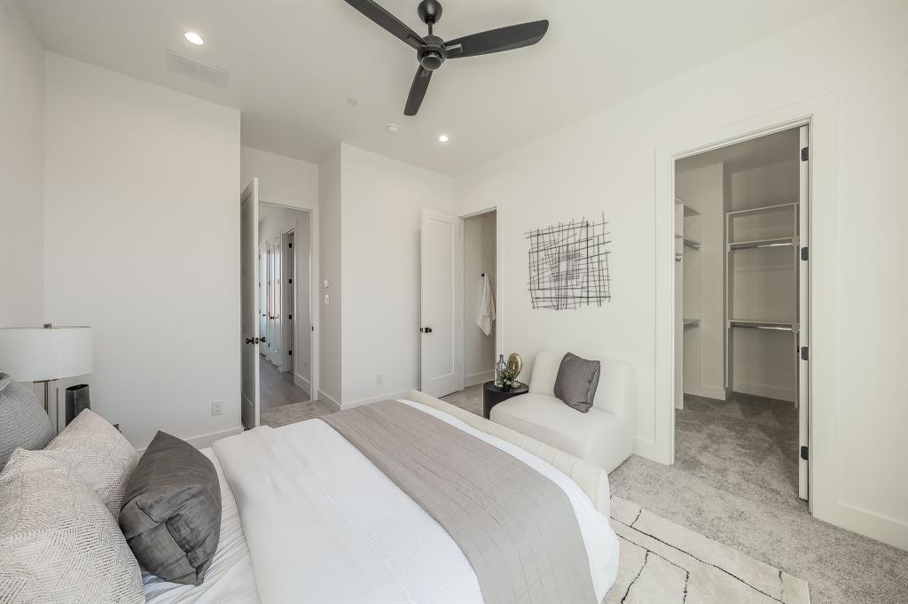 5320 Reiger Avenue, Unit 102 Dallas, TX 75214 - Photo 18 of 33 a bedroom with a bed and a walk in closet