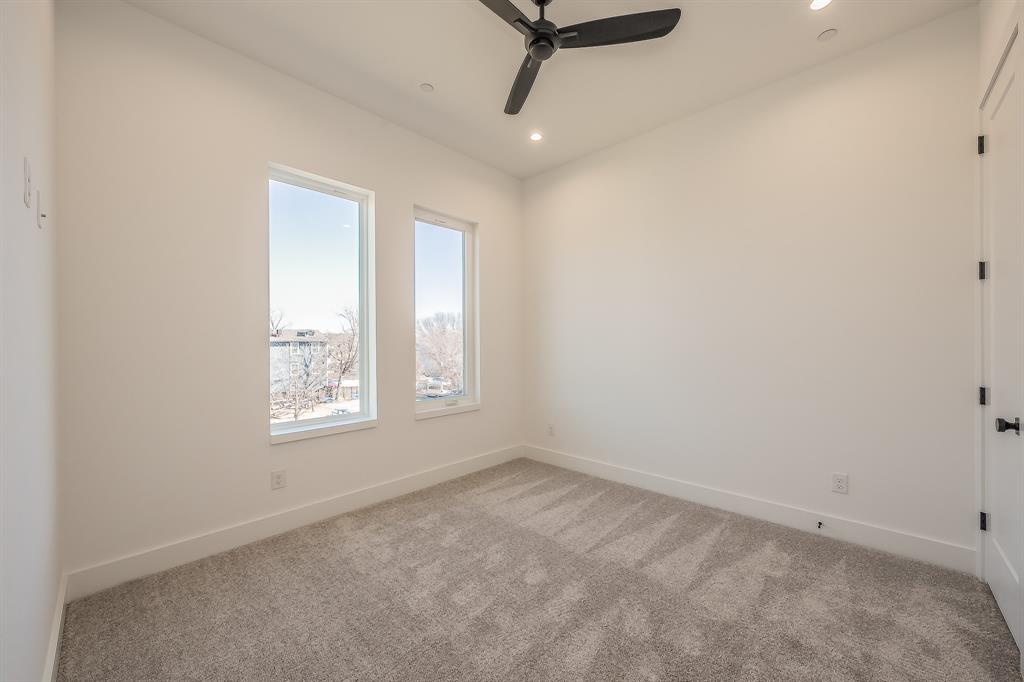 5320 Reiger Avenue, Unit 102 Dallas, TX 75214 - Photo 22 of 33 an empty room with windows