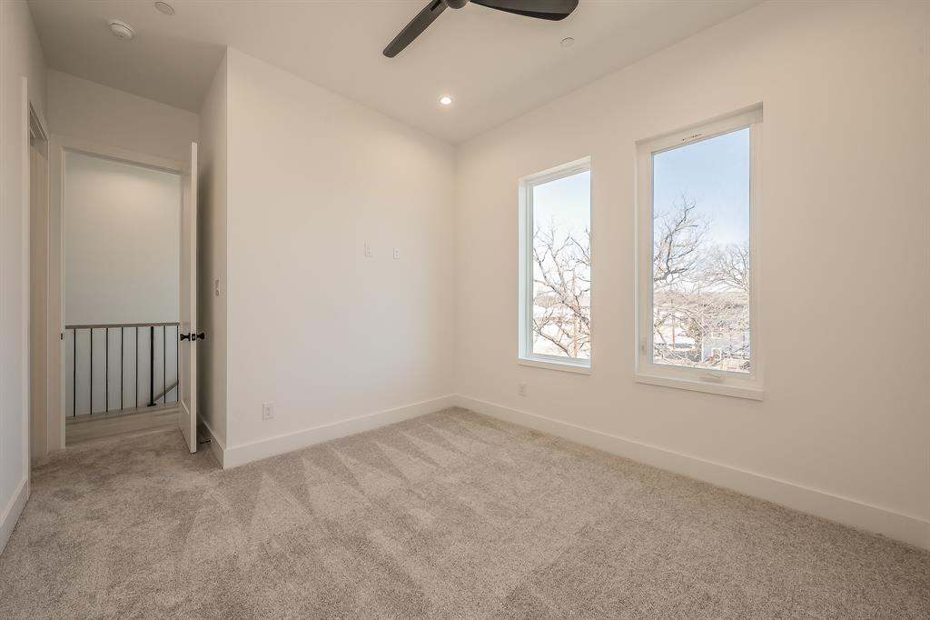 5320 Reiger Avenue, Unit 102 Dallas, TX 75214 - Photo 23 of 33 an empty room with windows