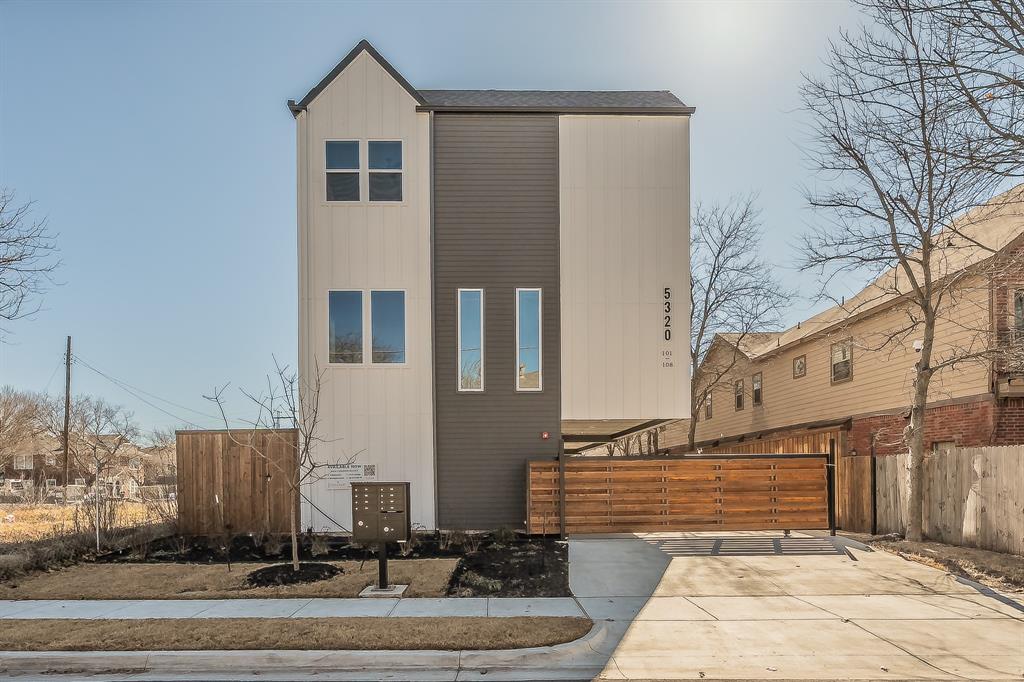 5320 Reiger Avenue, Unit 102 Dallas, TX 75214 - Photo 26 of 33 a front view of a house with a yard