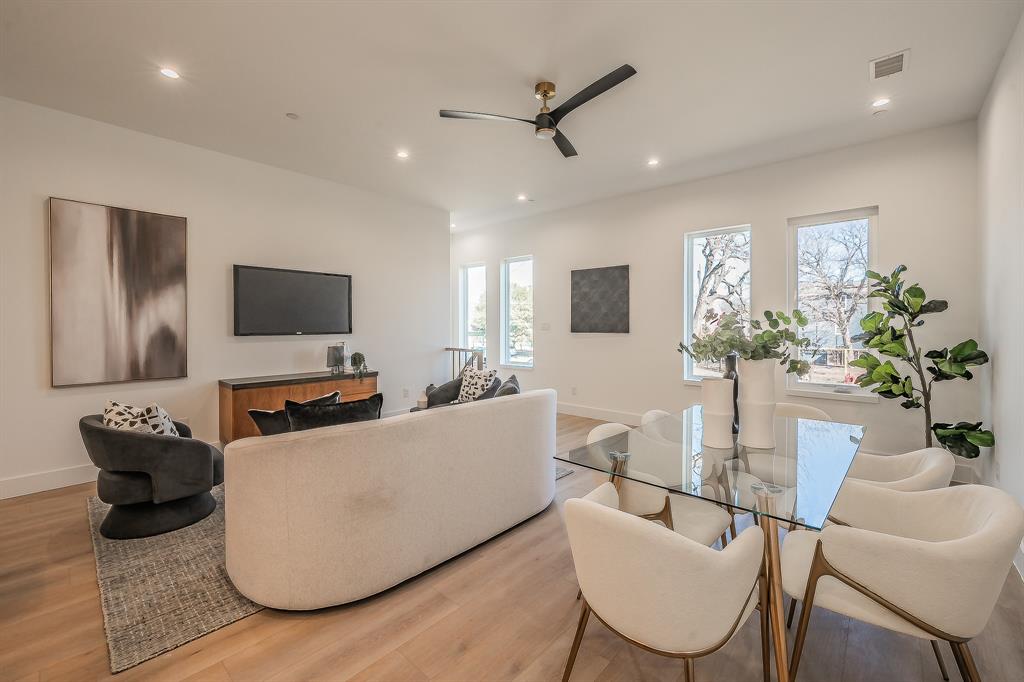 5320 Reiger Avenue, Unit 102 Dallas, TX 75214 - Photo 3 of 33 a living room with furniture and a flat screen tv